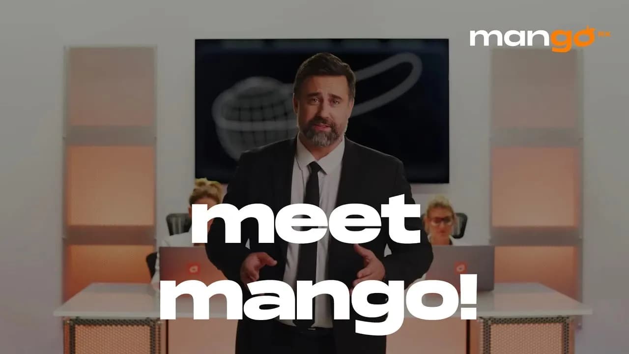 A MangoRx spokesman in an office under the words meet mango