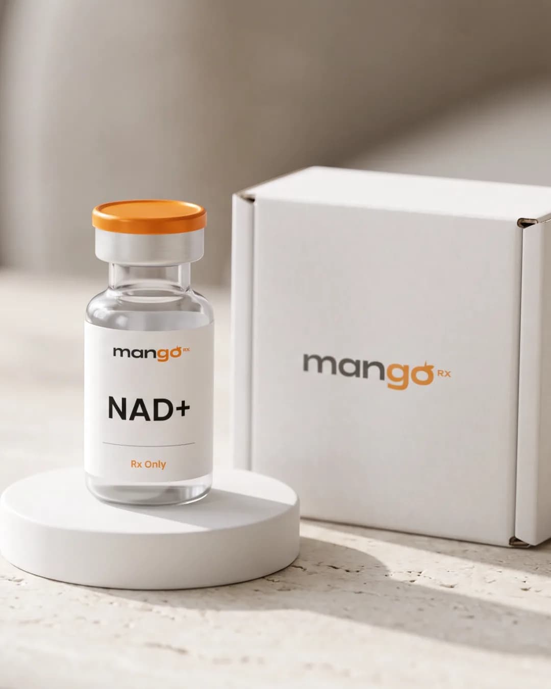 A MangoRx NAD+ injection vial on a white plinth beside its mailer