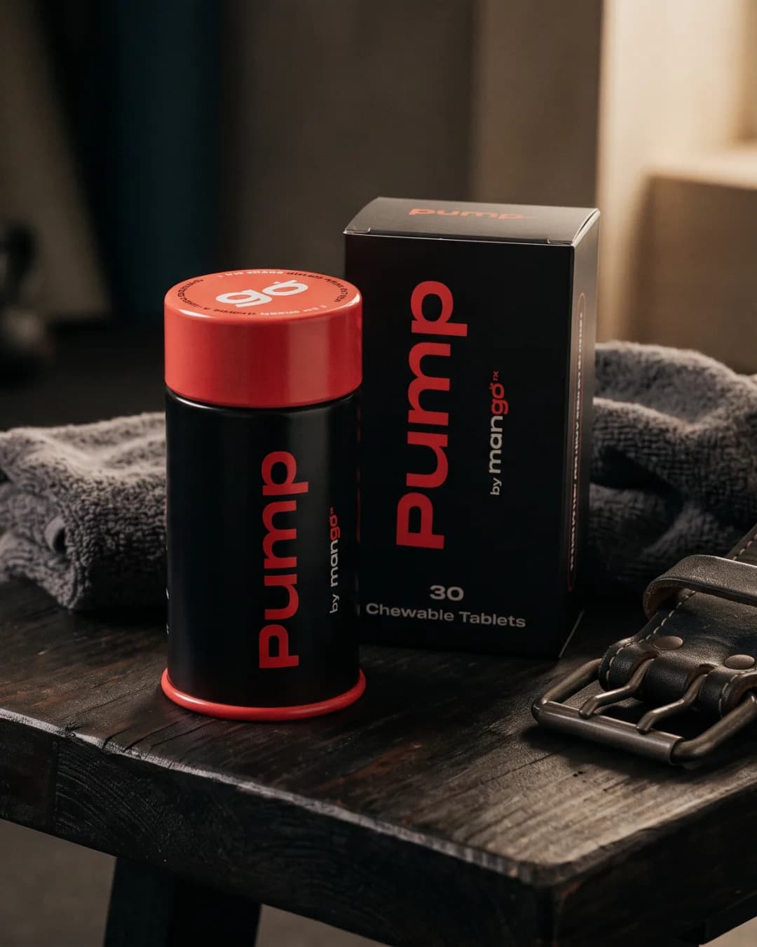 A black Pump tin with a red cap and its box on a gym bench