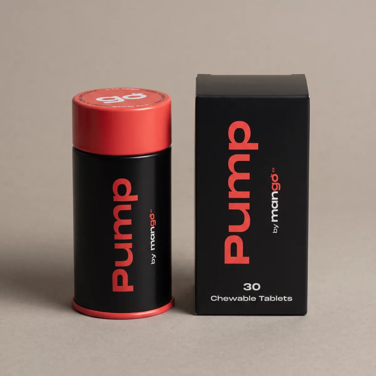 A black Pump tin with a red cap beside its box